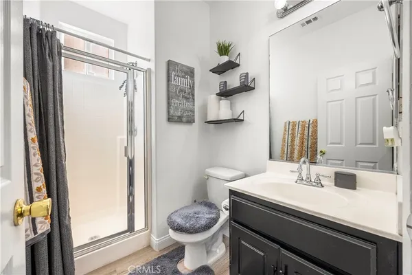 a bathroom with a sink toilet and shower