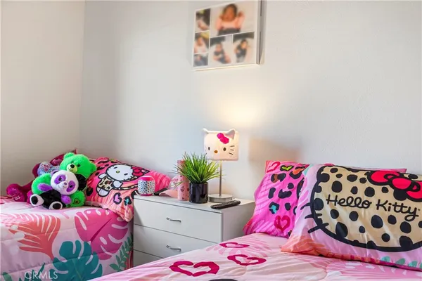 a bedroom with a bed and dresser