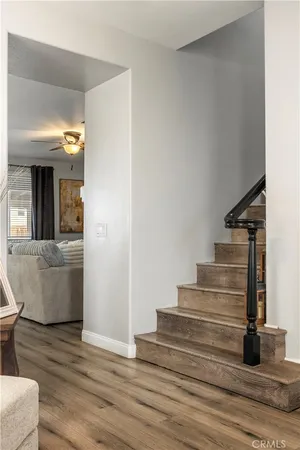 a view of entryway and hall with wooden floor