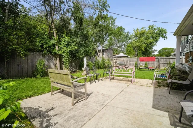 a view of a bench in a backyard