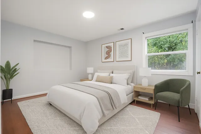 a bedroom with a bed and a couch