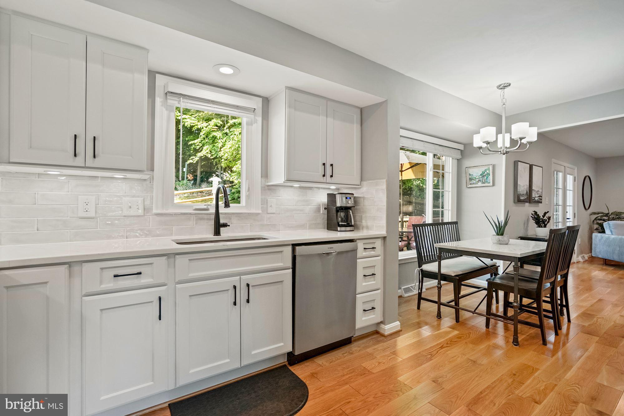 8810 Shadowlake Way Springfield, VA 22153 - Photo 14 of 41 All-white cabinets with under-cabinet lighting
