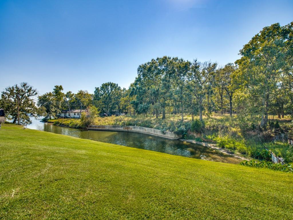 233 Esquire Estates Road Mabank, TX 75156 - Photo 24 of 34 View of green lawn featuring a water view