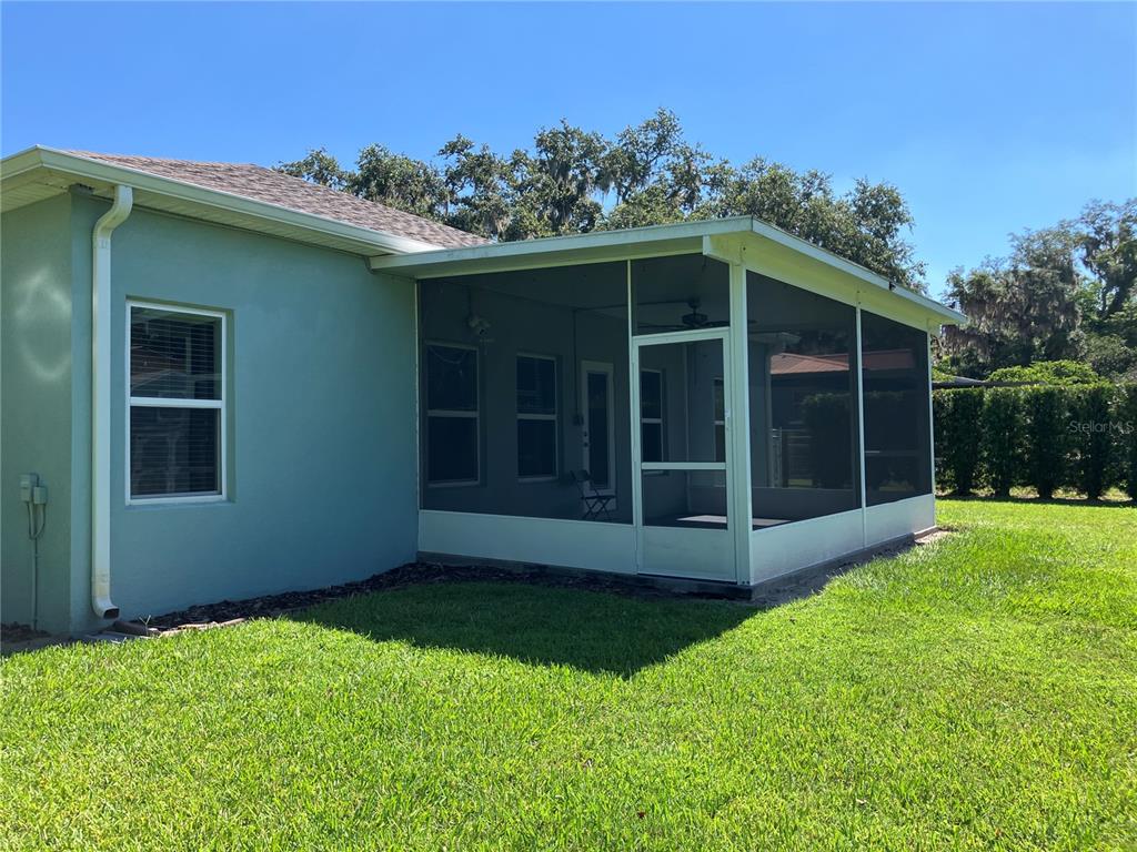 3834 Charter Road Lakeland, FL 33810 - Photo 27 of 39 a view of front door of a house with a yard