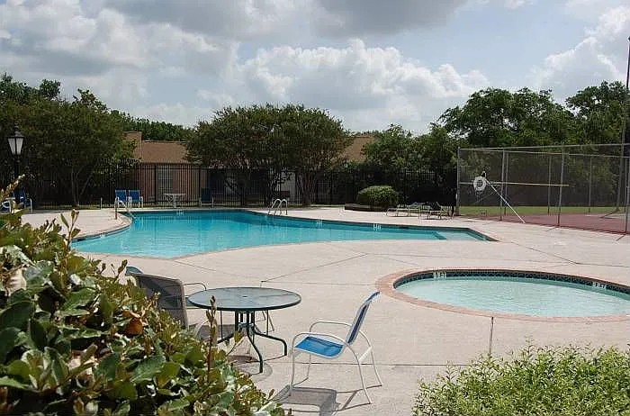 8925 North Plaza, Unit 69 Austin, TX 78753 - Photo 28 of 29 a swimming pool with outdoor seating and yard