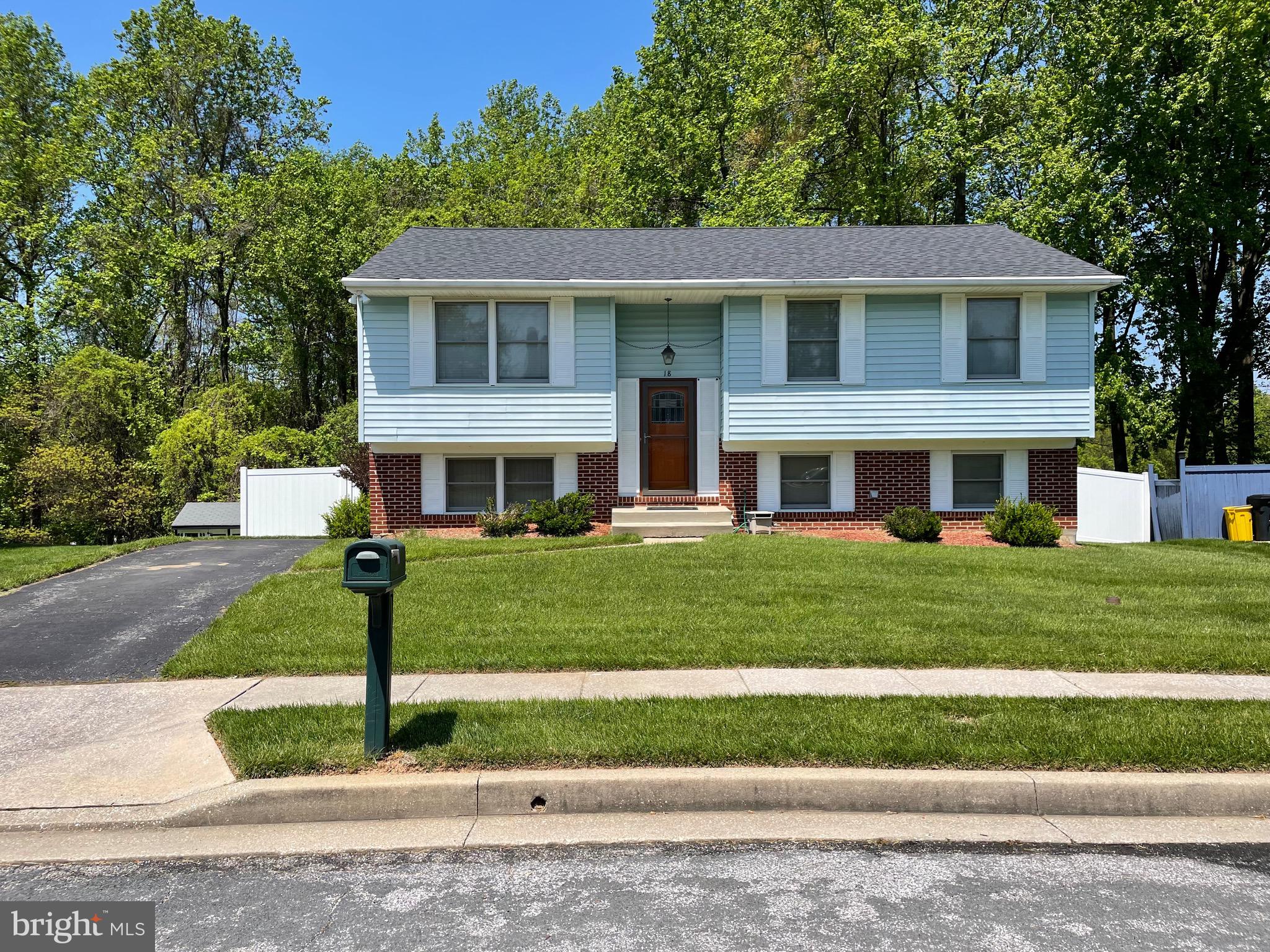 18 Jameson Lane Baltimore, MD 21208 - Photo 1 of 39 a front view of a house with a yard