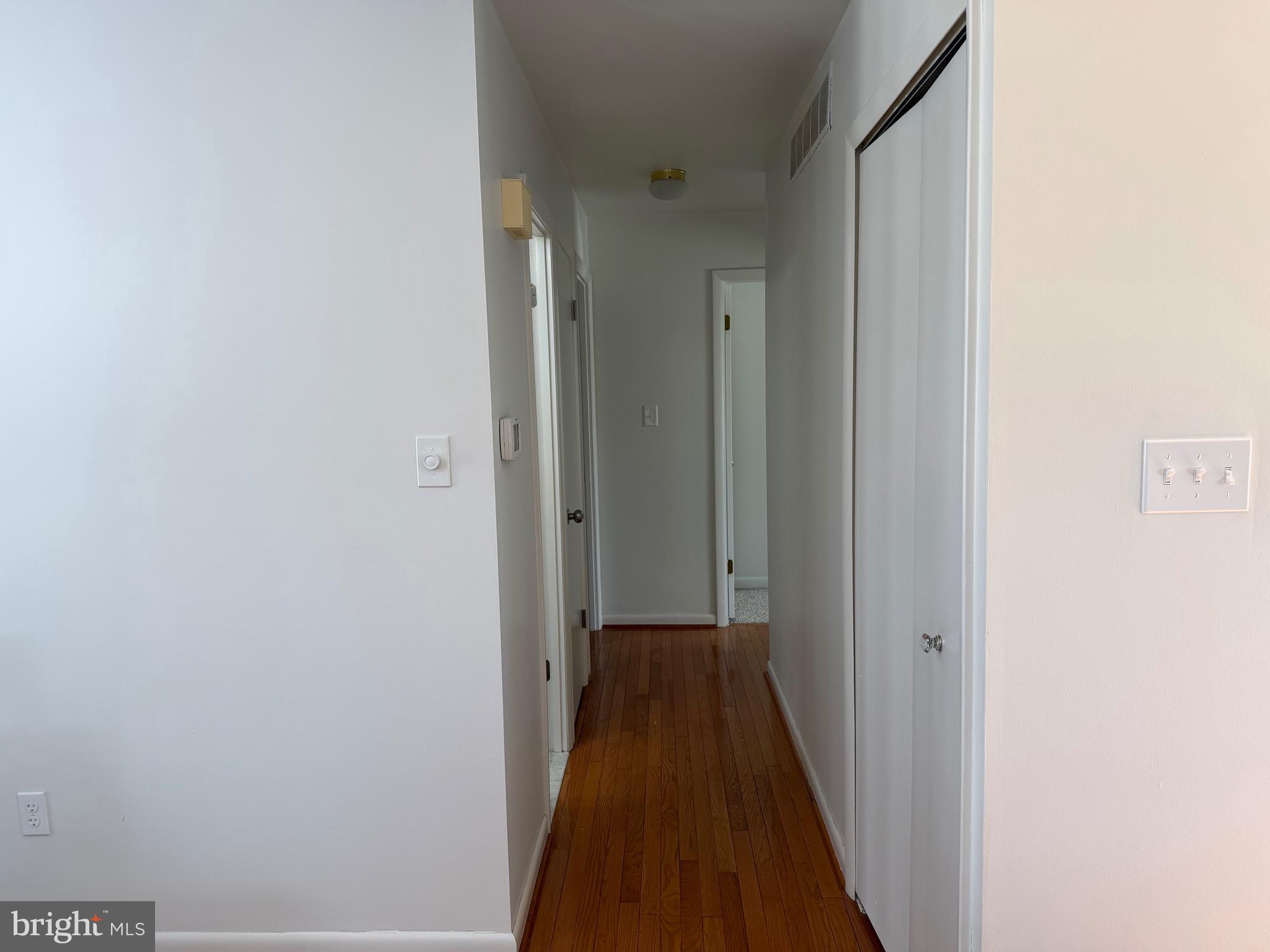 18 Jameson Lane Baltimore, MD 21208 - Photo 14 of 39 a view of a hallway with a wooden floor