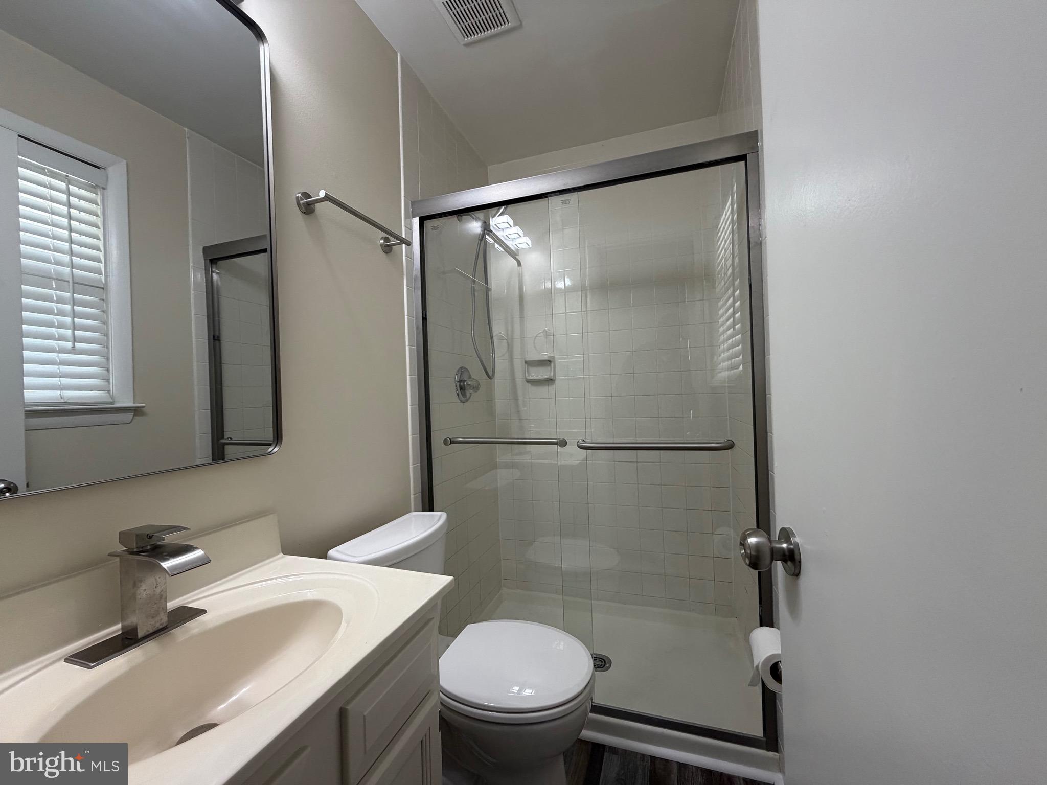 18 Jameson Lane Baltimore, MD 21208 - Photo 17 of 39 a bathroom with a sink toilet and shower