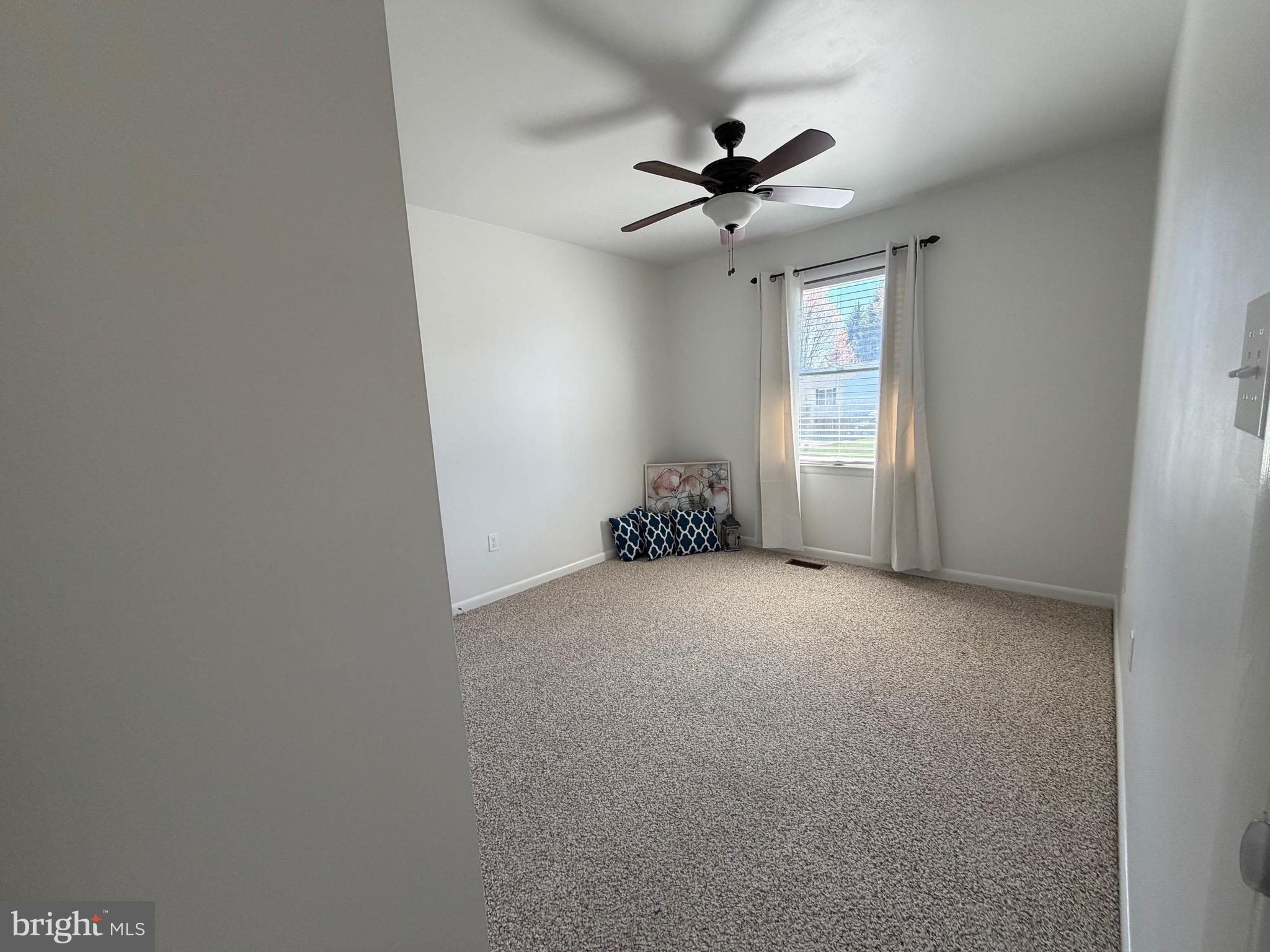 18 Jameson Lane Baltimore, MD 21208 - Photo 19 of 39 a view of a livingroom with a ceiling fan and window