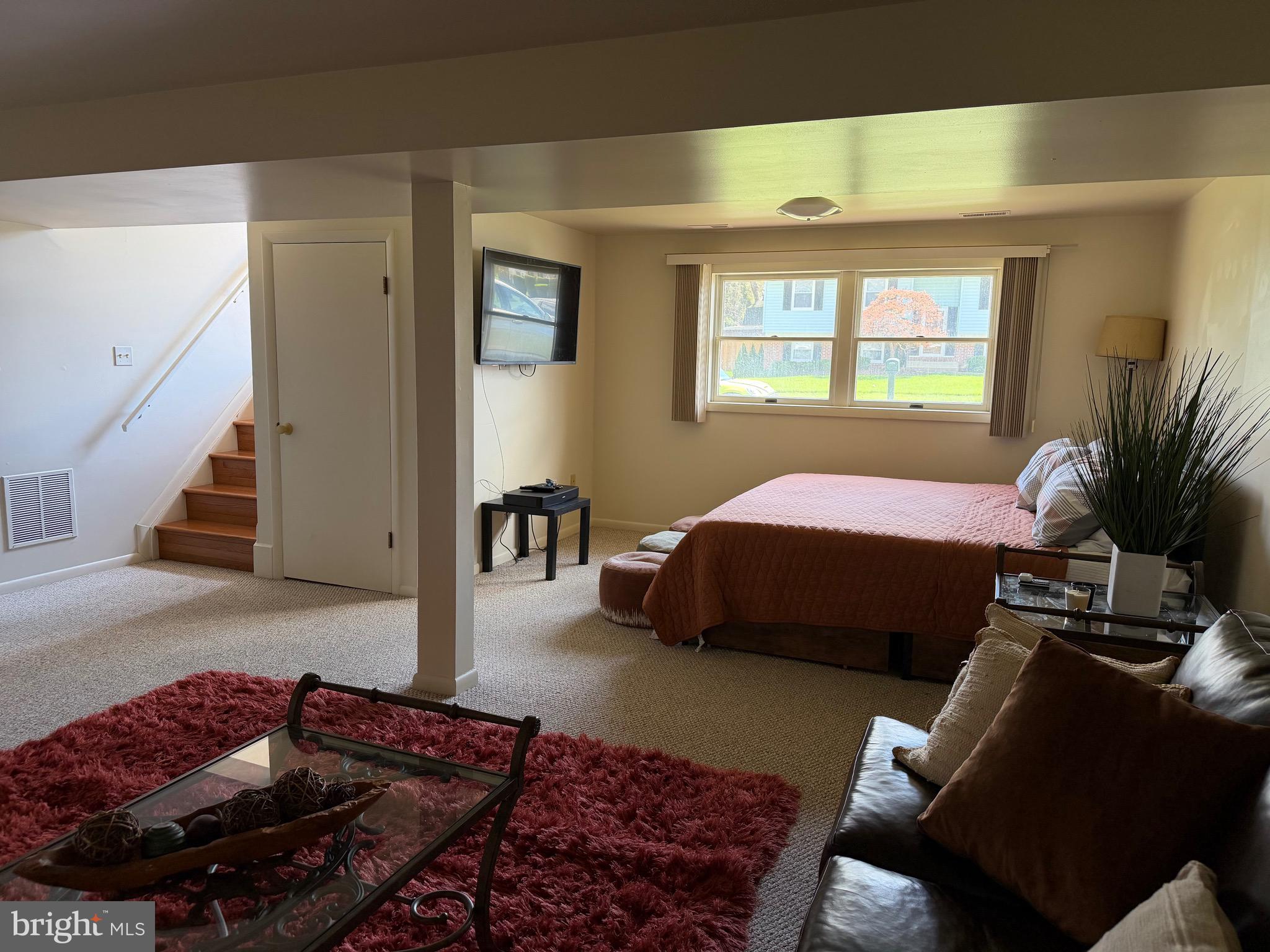 18 Jameson Lane Baltimore, MD 21208 - Photo 23 of 39 a bedroom with bed couch and window
