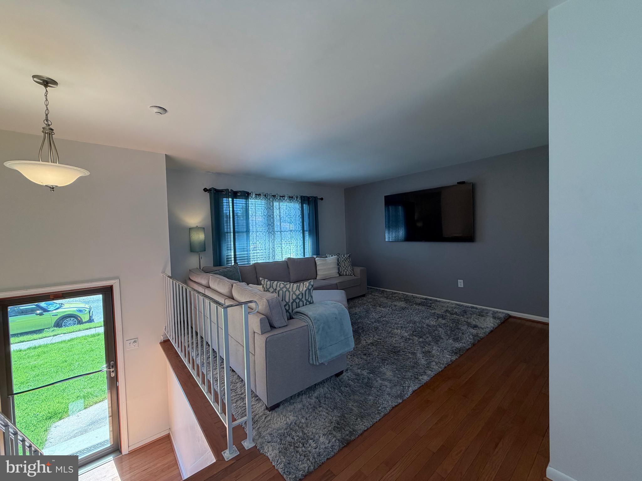 18 Jameson Lane Baltimore, MD 21208 - Photo 4 of 39 a living room with furniture and a flat screen tv