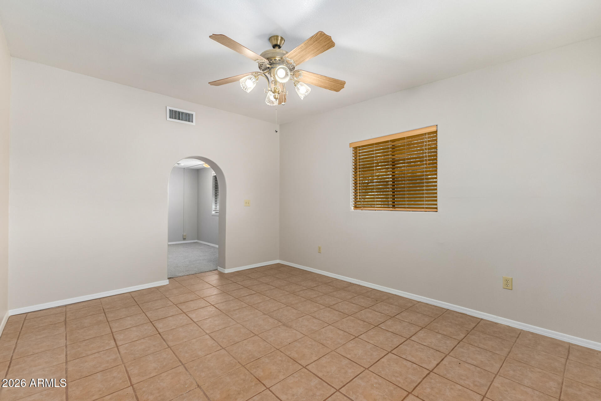 8714 North Dead Mans Gulch Road Florence, AZ 85132 - Photo 14 of 39 a view of an empty room with wooden floor