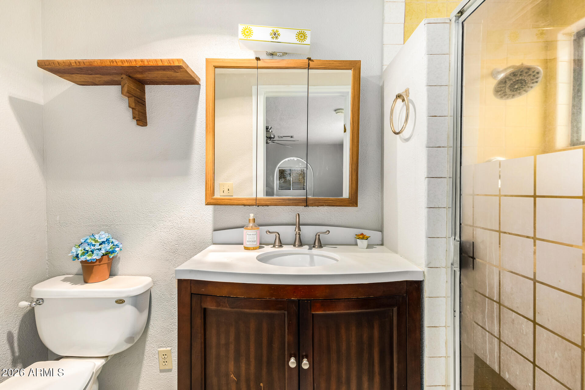 8714 North Dead Mans Gulch Road Florence, AZ 85132 - Photo 16 of 39 a bathroom with a sink and mirror with toilet