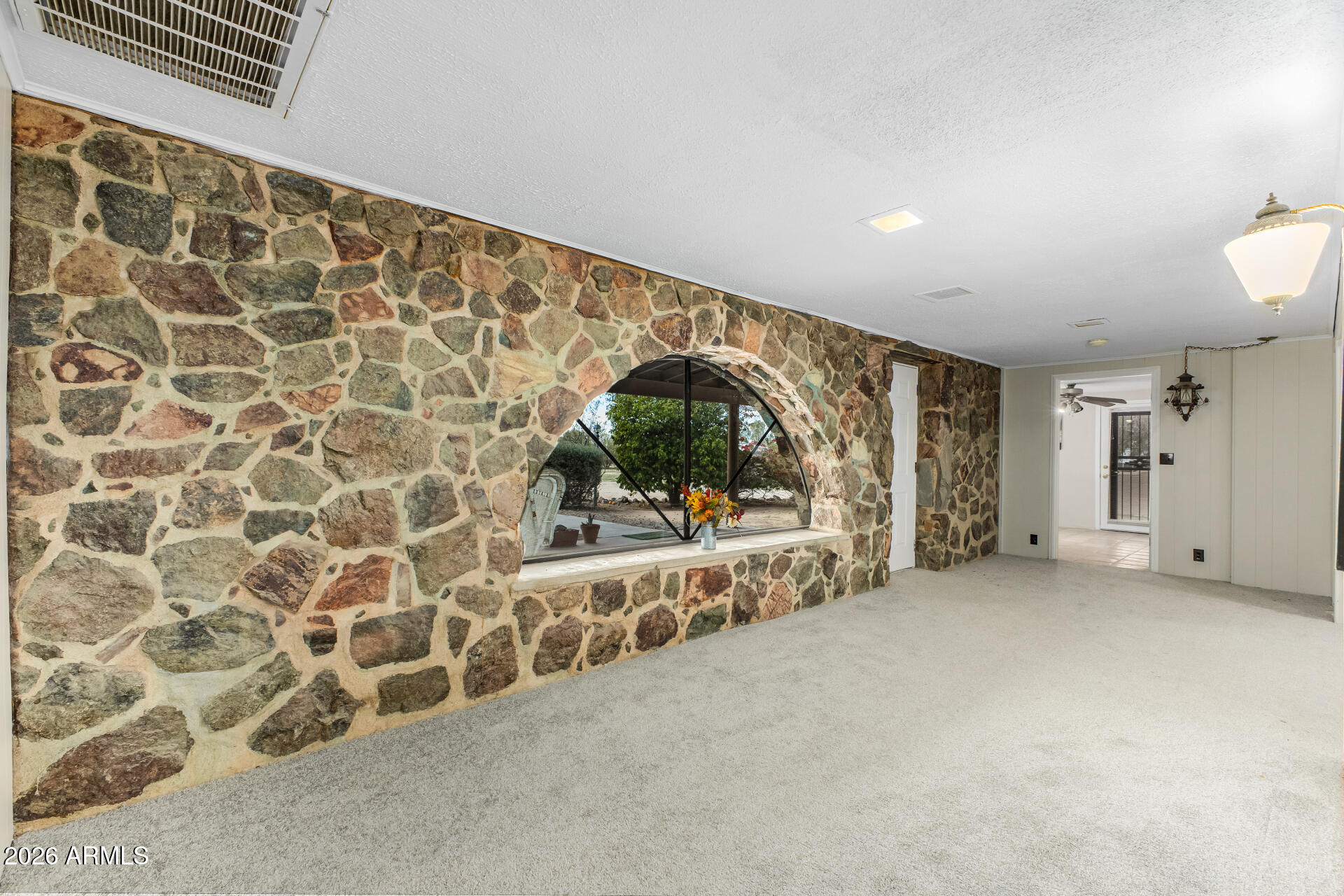 8714 North Dead Mans Gulch Road Florence, AZ 85132 - Photo 3 of 39 a view of an empty room with a window