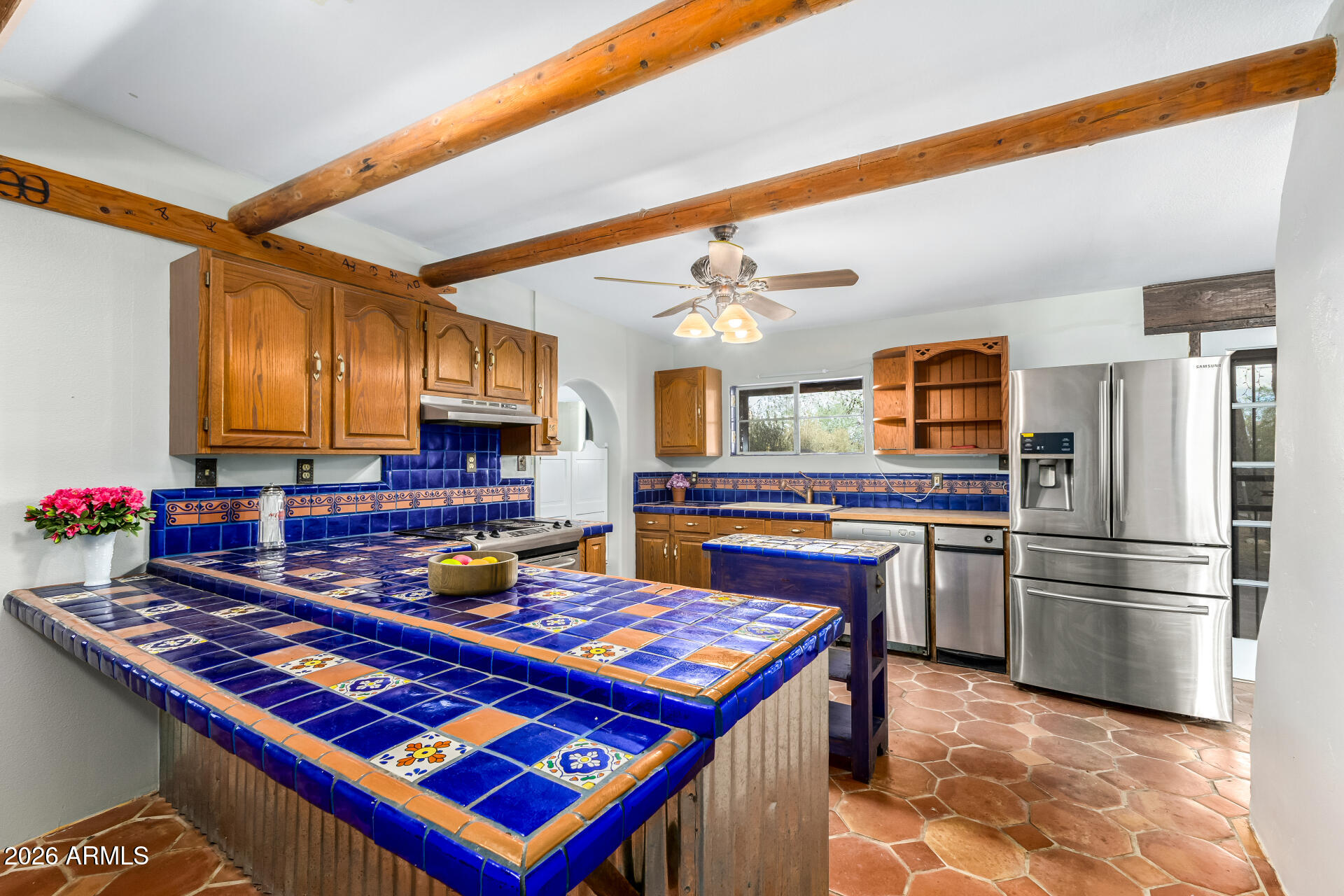 8714 North Dead Mans Gulch Road Florence, AZ 85132 - Photo 9 of 39 a kitchen with kitchen island granite countertop a sink cabinets and stainless steel appliances