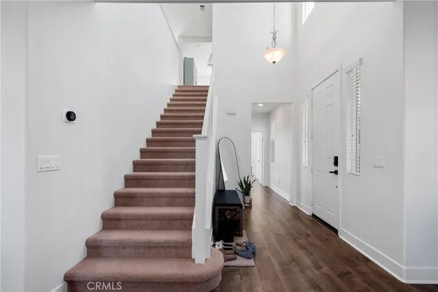 a view of an entryway with wooden floor