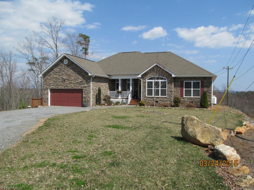 286 Red Brush Road Mount Airy, NC 27030 - Photo 1 of 30 Gorgeous 3 BR/2.5 BA Stone & Vinyl Home w/ Breath Taking Mountain Views and 2 Car Attached Garage.