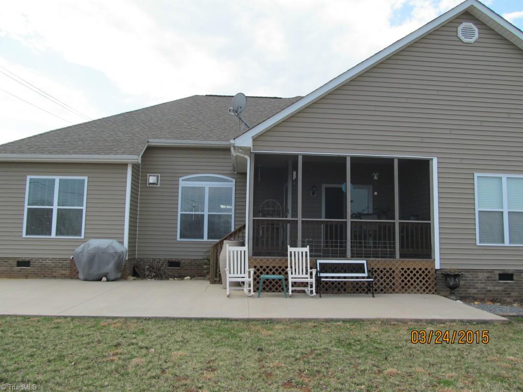 286 Red Brush Road Mount Airy, NC 27030 - Photo 4 of 30 Rear of Home w/ Concrete Patio & Screened Back Deck w/ Sliding Glass Doors.
