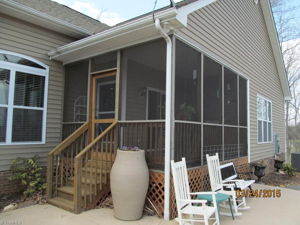 286 Red Brush Road Mount Airy, NC 27030 - Photo 5 of 30 Screened-In Back Deck w/ Sliding Glass Doors and a Concrete Patio.