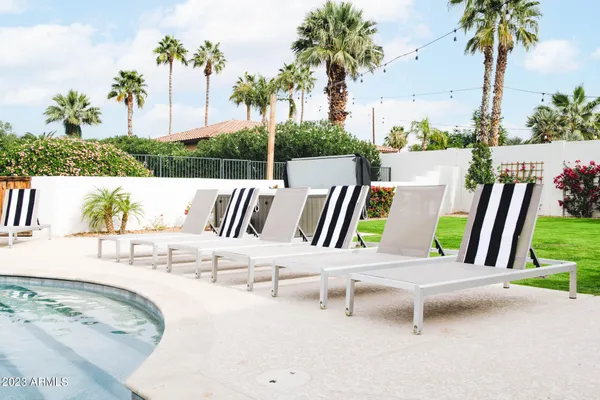 a view of a swimming pool with a patio