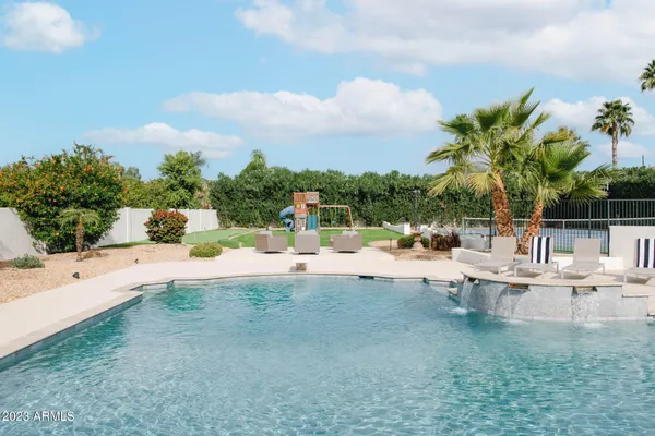 a view of a swimming pool with a patio