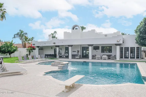 a view of a swimming pool with a yard