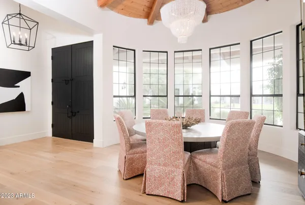 a dining room with furniture and window