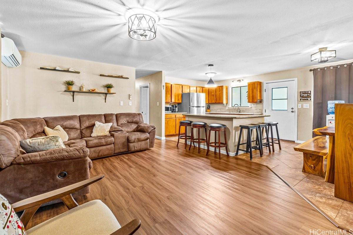 4806 Iiwi Road Kapaa, HI 96746 - Photo 12 of 25 a living room with furniture and wooden floor