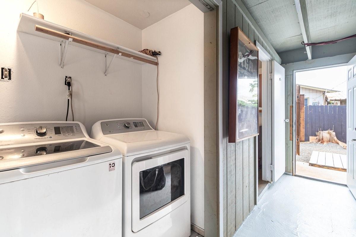 4806 Iiwi Road Kapaa, HI 96746 - Photo 20 of 25 a view of washer and dryer with bathroom in the background