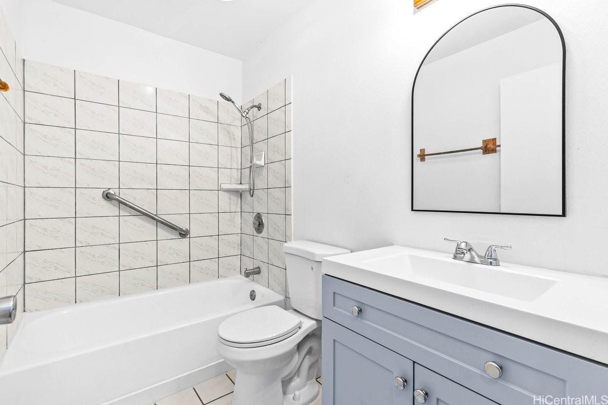 4806 Iiwi Road Kapaa, HI 96746 - Photo 7 of 25 a bathroom with a sink a toilet and shower