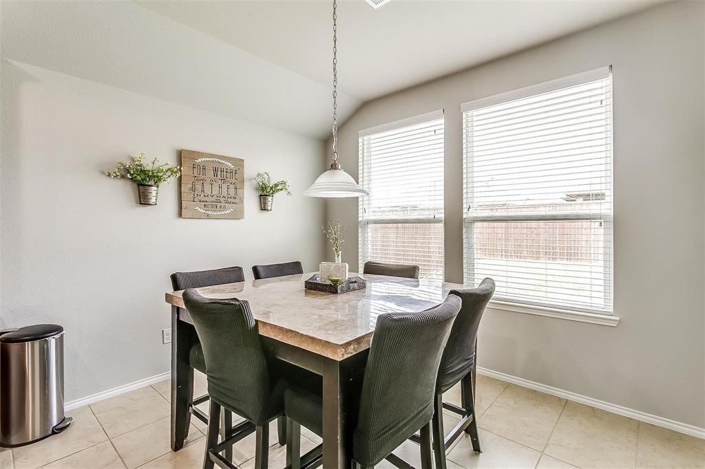 1629 Ridge Creek Lane Aubrey, TX 76227 - Photo 11 of 25 Dining area with vaulted ceiling and light tile patterned floors