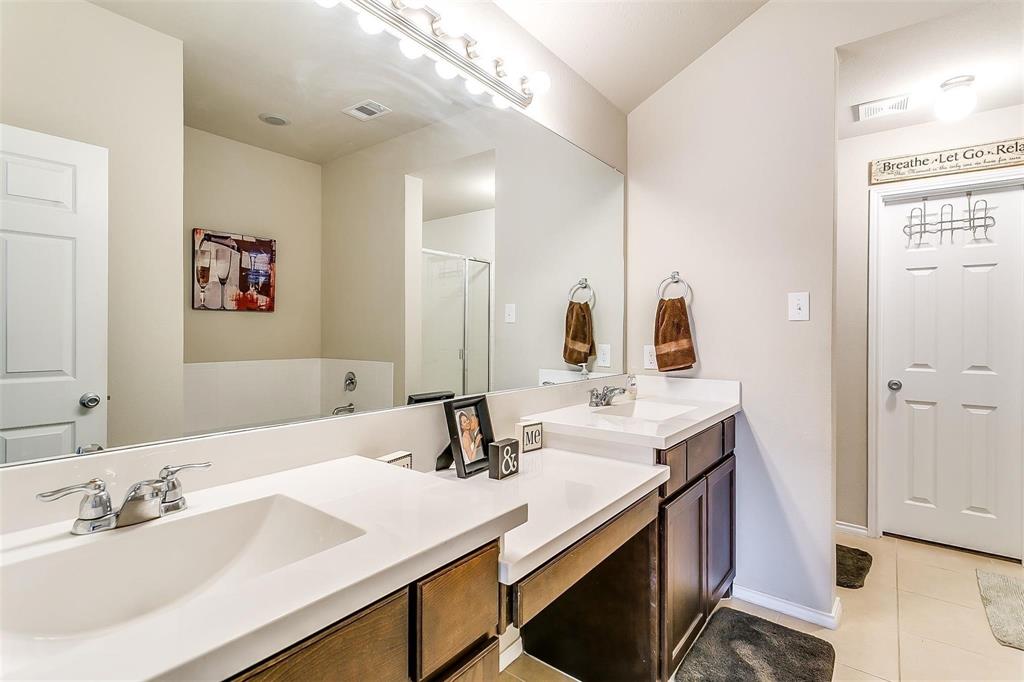 1629 Ridge Creek Lane Aubrey, TX 76227 - Photo 20 of 25 Full bathroom with a stall shower, light tile patterned floors, and double vanity