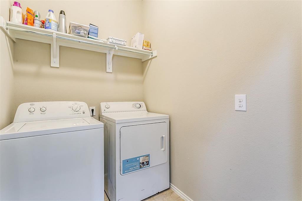 1629 Ridge Creek Lane Aubrey, TX 76227 - Photo 22 of 25 Washroom with baseboards and washing machine and dryer