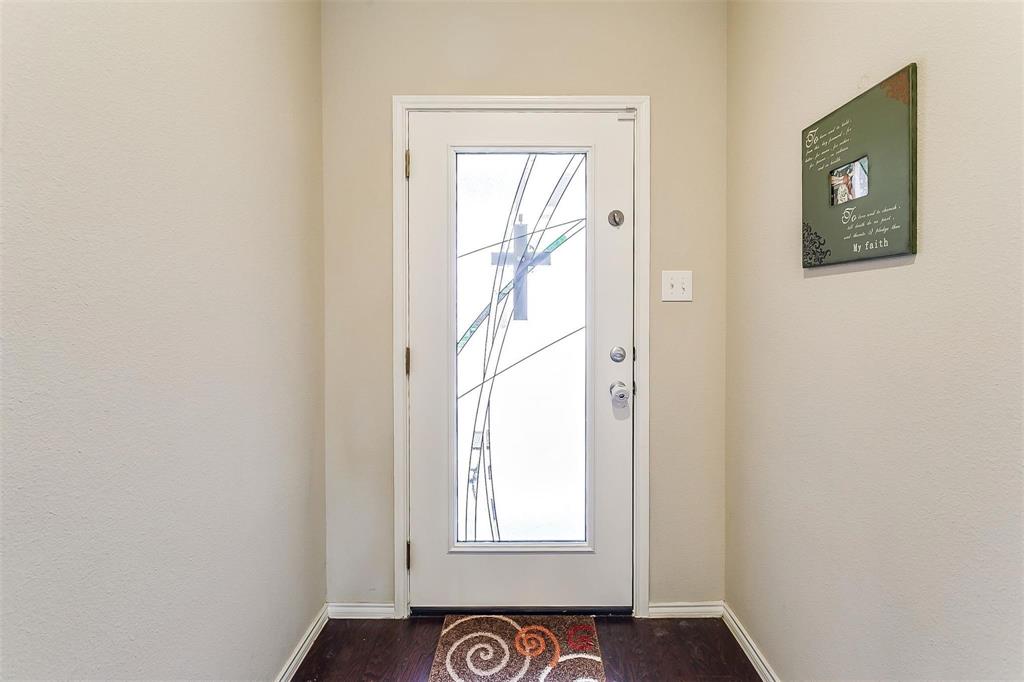 1629 Ridge Creek Lane Aubrey, TX 76227 - Photo 4 of 25 Doorway to outside with wood finished floors and baseboards
