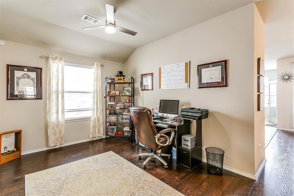 1629 Ridge Creek Lane Aubrey, TX 76227 - Photo 5 of 25 Home office featuring dark wood-style flooring, vaulted ceiling, and a ceiling fan