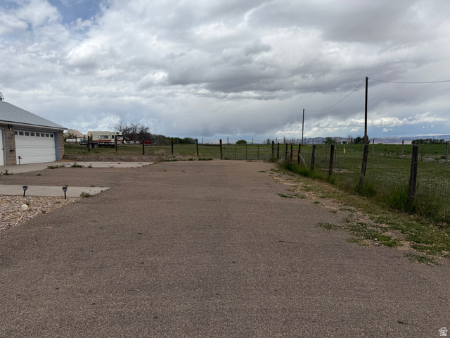 1043 East 4000th Street South Vernal, UT 84078 - Photo 4 of 31 Paved driveway apron with a two-car garage