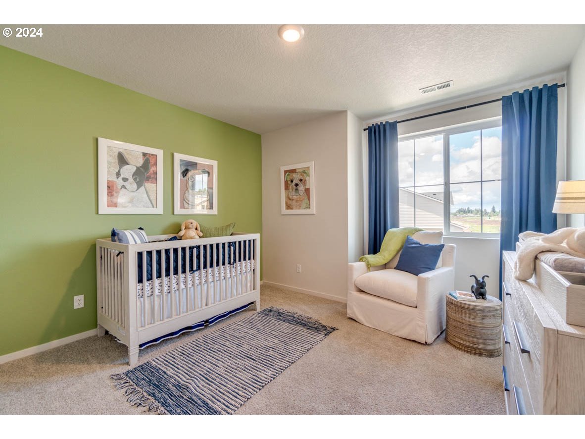 2604 U Street Springfield, OR 97477 - Photo 11 of 19 a bedroom with furniture and a window