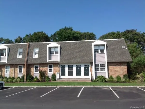 a view of a building with a yard