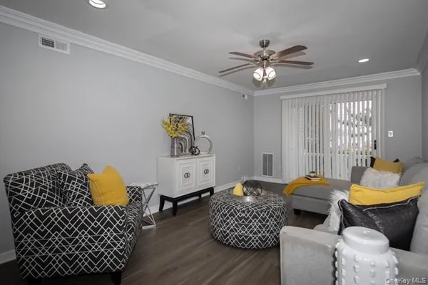 a living room with furniture and lamp