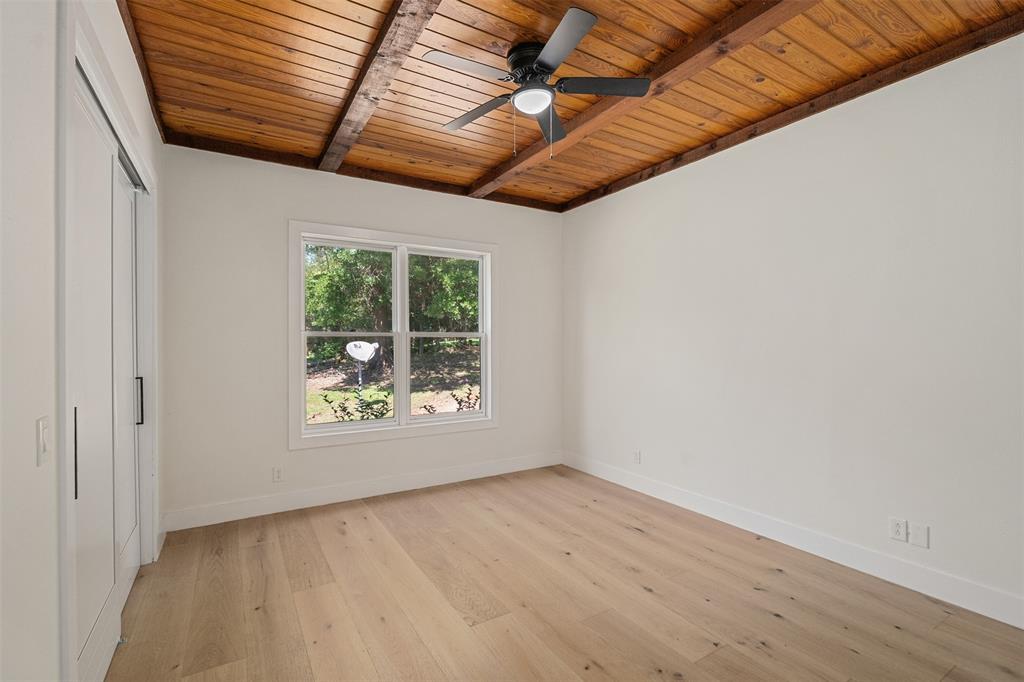 14354 Ridge Lane Malakoff, TX 75148 - Photo 21 of 40 an empty room with wooden floor and windows