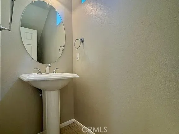 a bathroom with a sink and mirror