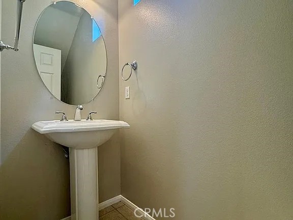 6 Evergreen Road Ladera Ranch, CA 92694 - Photo 11 of 27 a bathroom with a sink and mirror