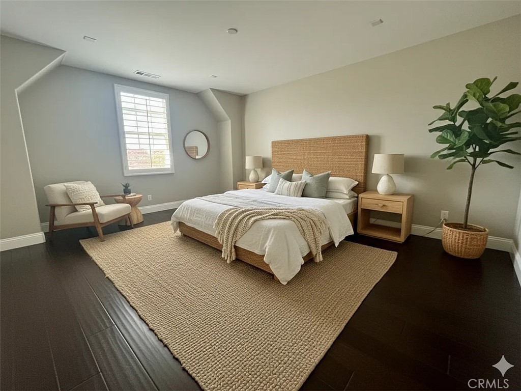 6 Evergreen Road Ladera Ranch, CA 92694 - Photo 14 of 27 a bedroom with bed and a potted plant
