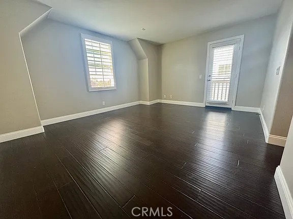 6 Evergreen Road Ladera Ranch, CA 92694 - Photo 15 of 27 an empty room with wooden floor and windows