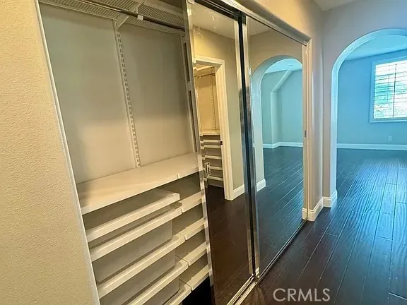 a bathroom with a glass door shower and a sink