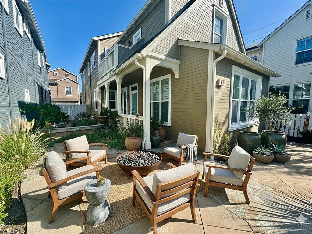 6 Evergreen Road Ladera Ranch, CA 92694 - Photo 2 of 27 a view of a patio with couches table and chairs and potted plants