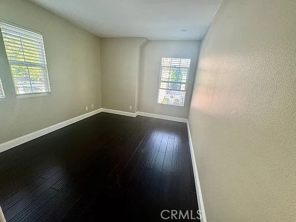 6 Evergreen Road Ladera Ranch, CA 92694 - Photo 21 of 27 an empty room with wooden floor and windows
