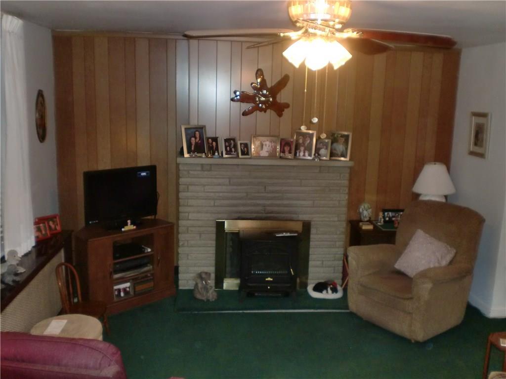 Large 18x14 Living Room with working log burning fireplace (the sellers found it more convenient to use the electric unit, which will be going with them)