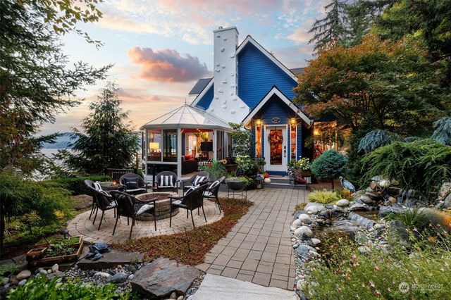 a front view of a house with garden