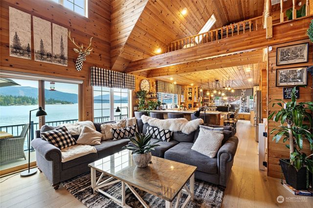 a view of a patio with couches and potted plants